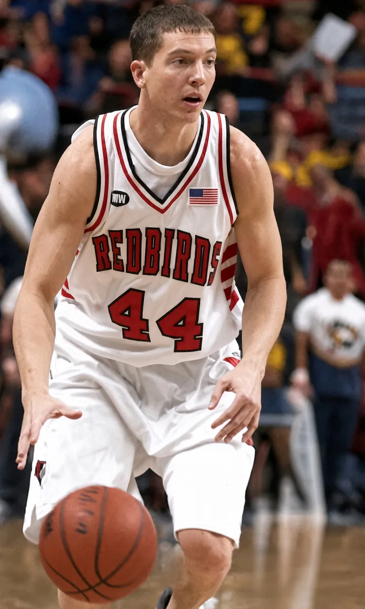 Brett Gillan dribbling a basketball in an Illinois State Redbirds number 44 jersey